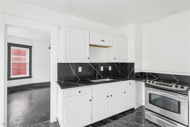 kitchen featuring tasteful backsplash, sink, white cabinets, dark hardwood / wood-style floors, and stainless steel electric range oven