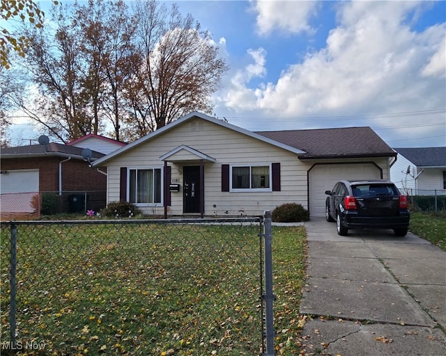 single story home with a garage and a front lawn