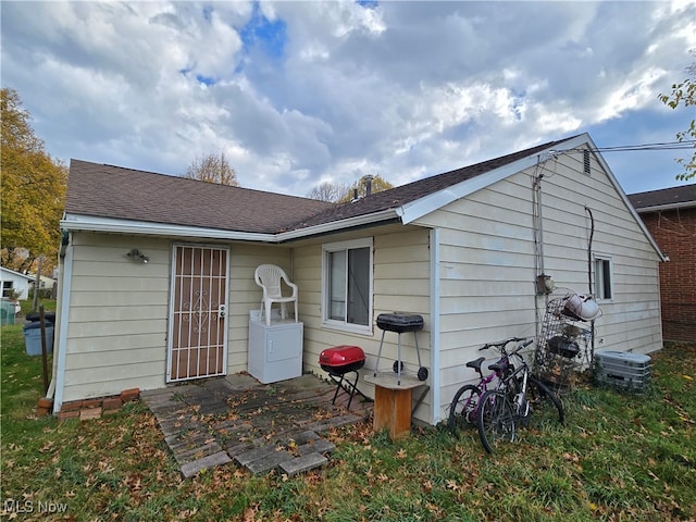 back of property with washer / clothes dryer