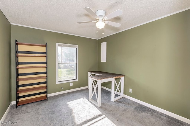 unfurnished office with carpet flooring, ceiling fan, ornamental molding, and a textured ceiling