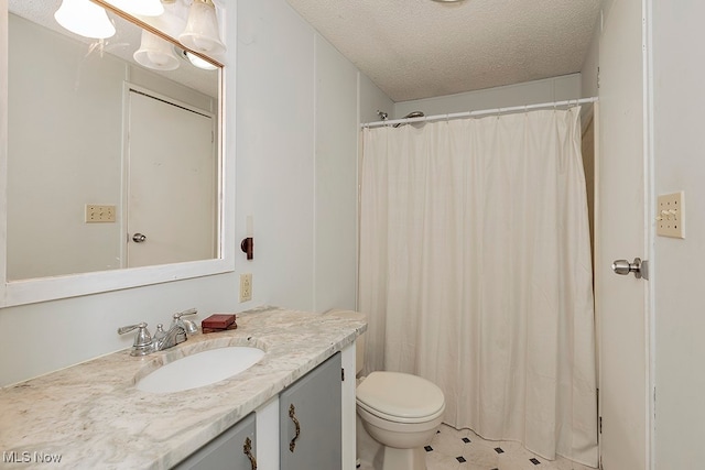 bathroom featuring vanity, a shower with shower curtain, a textured ceiling, and toilet