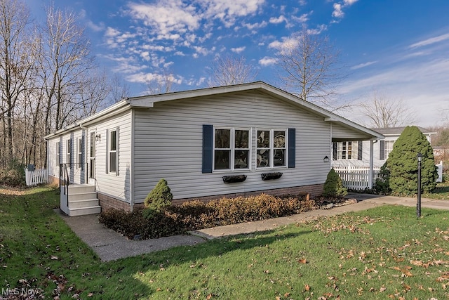 view of property exterior featuring a lawn