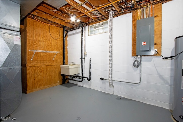 basement with sink, electric panel, and heating unit