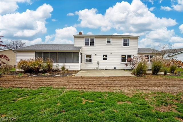 back of house featuring a patio area and a sunroom