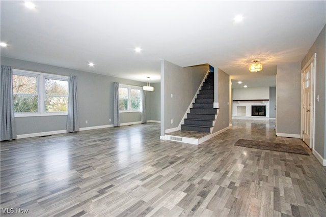 unfurnished living room featuring light hardwood / wood-style floors