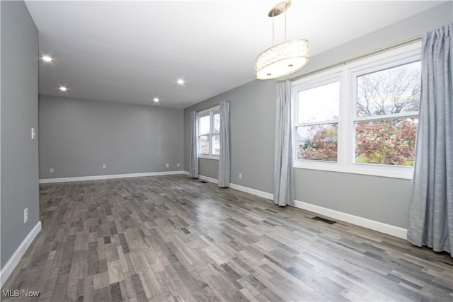 spare room featuring hardwood / wood-style flooring