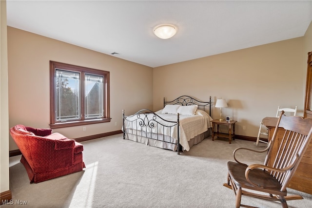 bedroom featuring light carpet