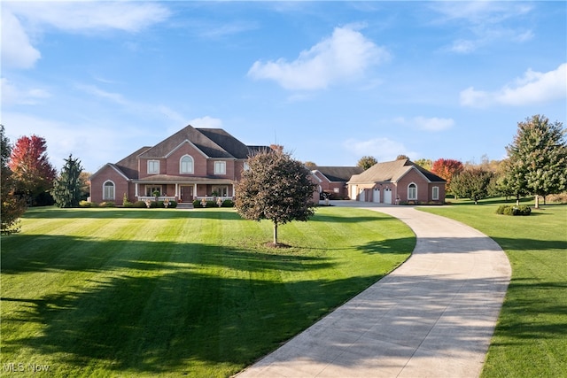 view of front of property featuring a front lawn and a garage