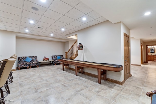 rec room featuring a paneled ceiling