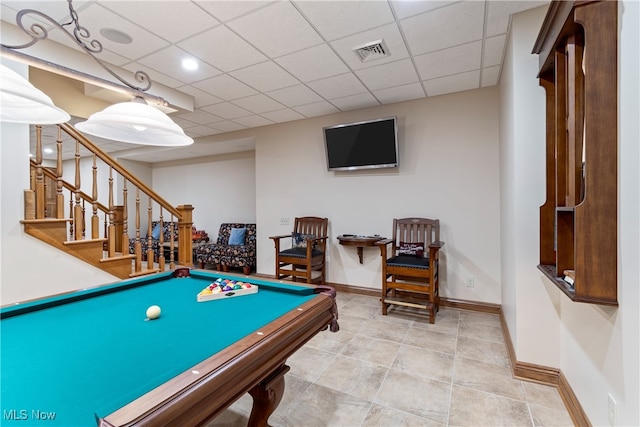 game room with light tile patterned floors, a paneled ceiling, and billiards