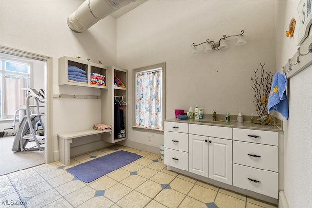 bathroom featuring tile patterned flooring and vanity