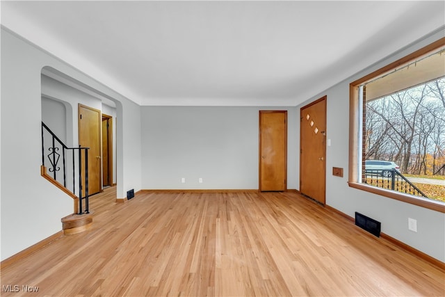 unfurnished room featuring light hardwood / wood-style flooring