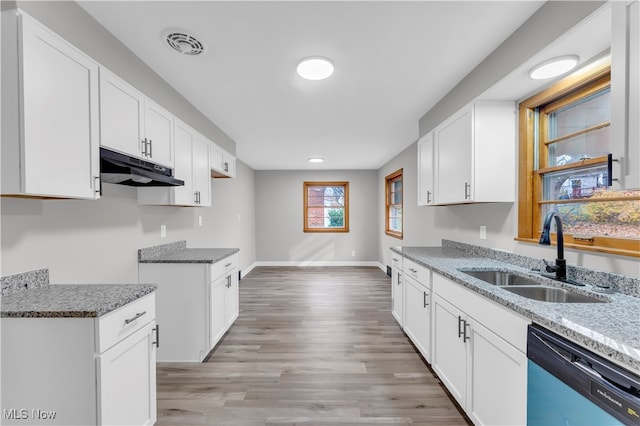 kitchen with light wood-type flooring, sink, stone countertops, dishwasher, and white cabinetry