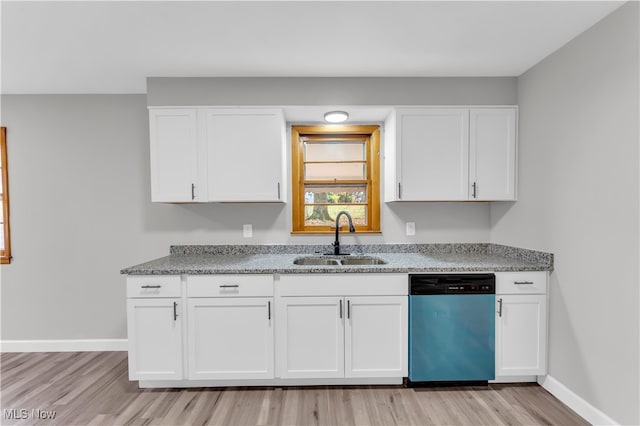 kitchen featuring white cabinets, dishwasher, sink, and light hardwood / wood-style flooring