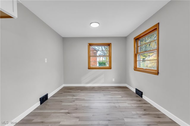 spare room with light wood-type flooring