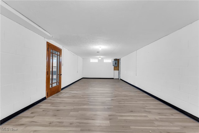 empty room featuring light hardwood / wood-style floors and a textured ceiling