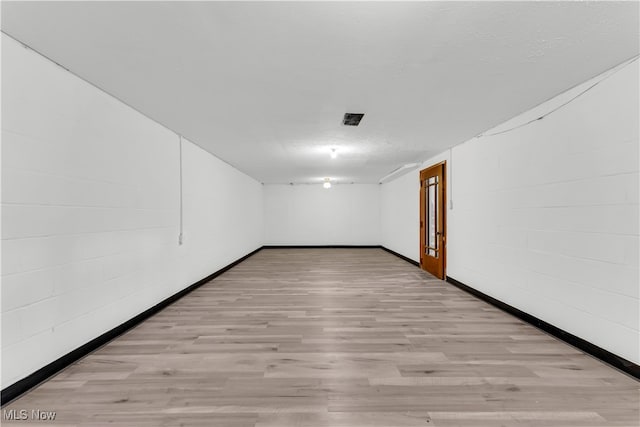 spare room featuring light hardwood / wood-style floors