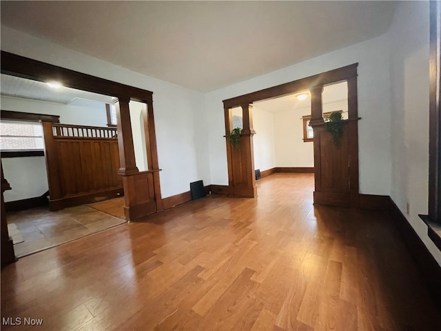 spare room with hardwood / wood-style floors