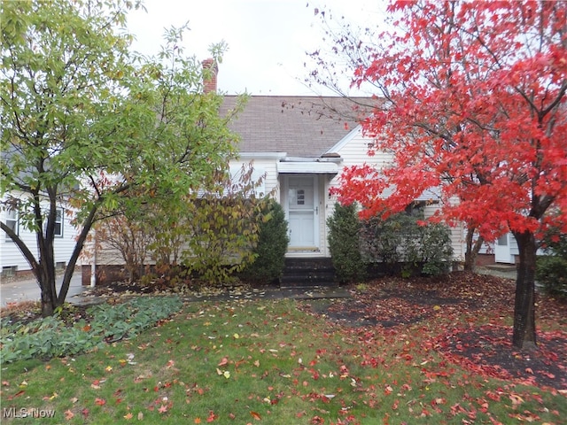 view of property hidden behind natural elements