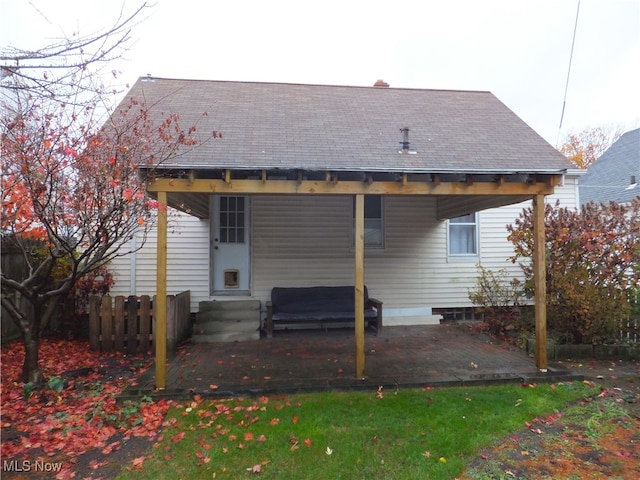 back of house with a patio