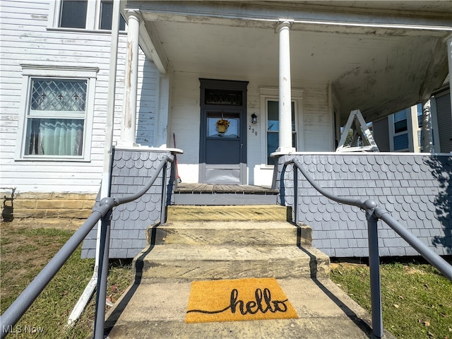 property entrance with covered porch