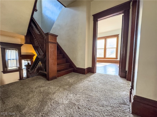 unfurnished living room featuring carpet floors