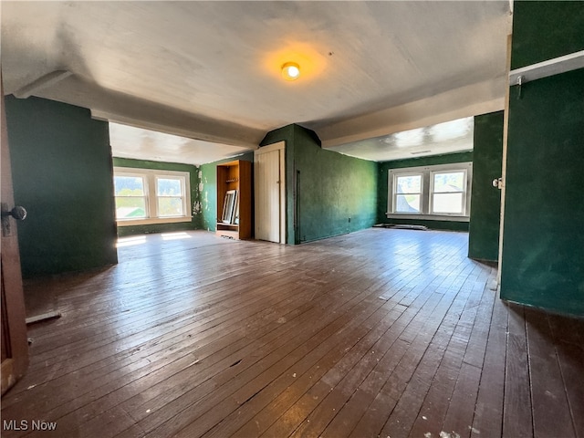 unfurnished room featuring dark wood-type flooring