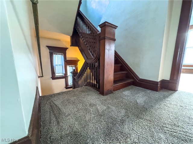 stairs featuring carpet