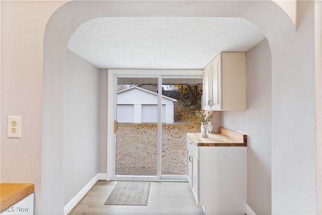 doorway to outside featuring light hardwood / wood-style flooring