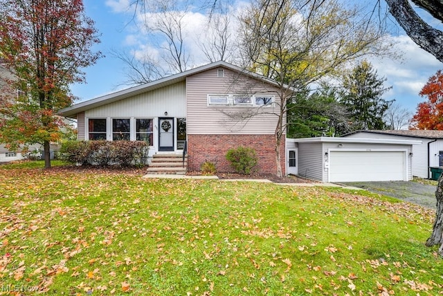 view of front of property featuring a garage and a front lawn