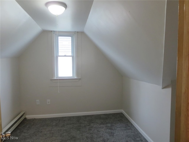 bonus room featuring dark colored carpet, vaulted ceiling, and a baseboard heating unit