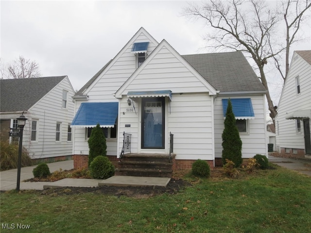 bungalow with a front lawn