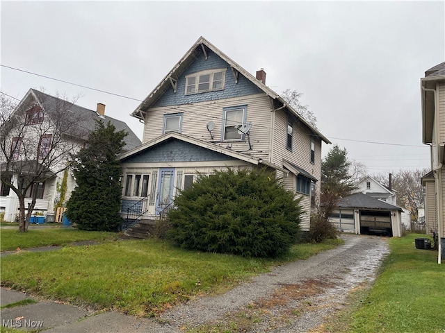 view of front of property with central AC unit and a front lawn