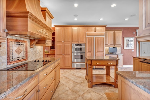 kitchen with light stone counters, crown molding, paneled built in refrigerator, decorative backsplash, and custom exhaust hood