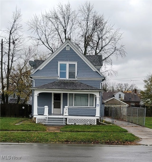 bungalow-style house featuring a front lawn and covered porch