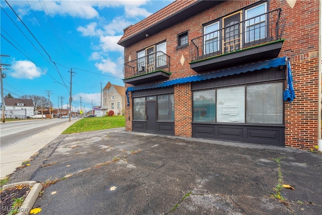 back of property with a balcony