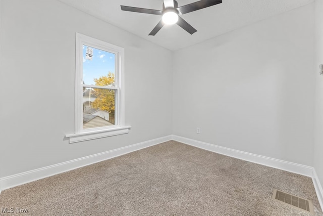 carpeted empty room with ceiling fan