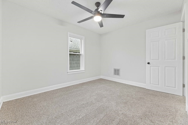 carpeted empty room with ceiling fan