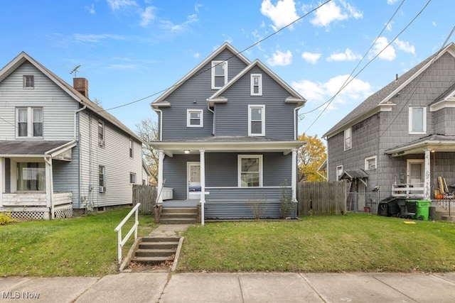 view of front property featuring a porch and a front lawn