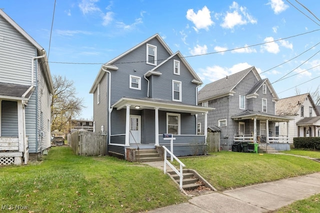 view of property with a porch and a front yard