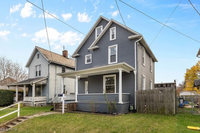 front facade featuring a porch and a front yard