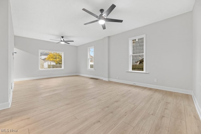 unfurnished room featuring ceiling fan and light wood-type flooring