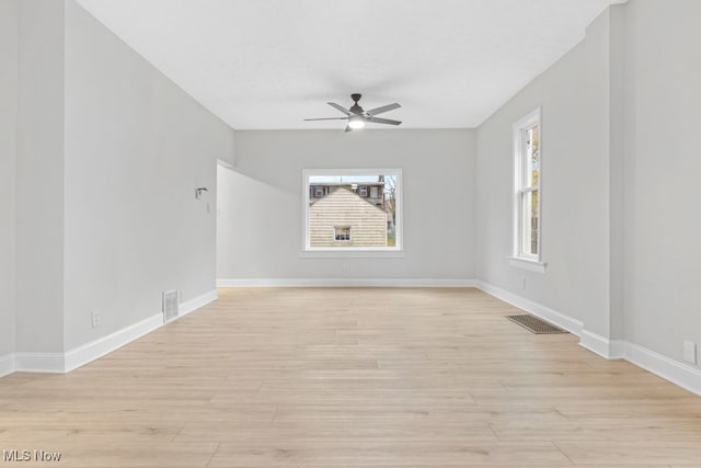 spare room with ceiling fan and light hardwood / wood-style flooring