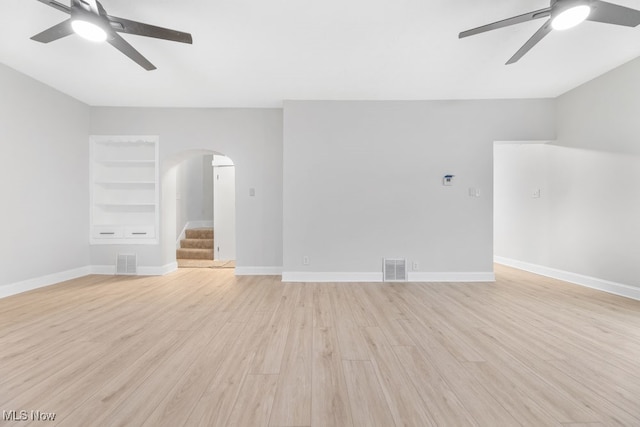 unfurnished living room with ceiling fan and light wood-type flooring