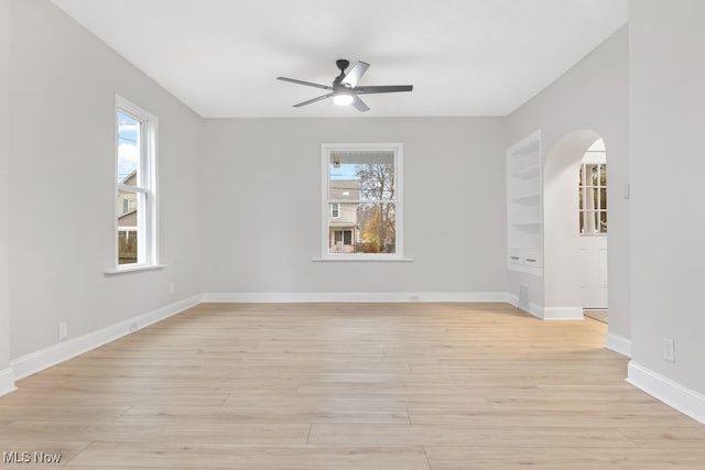 spare room featuring ceiling fan and light hardwood / wood-style floors