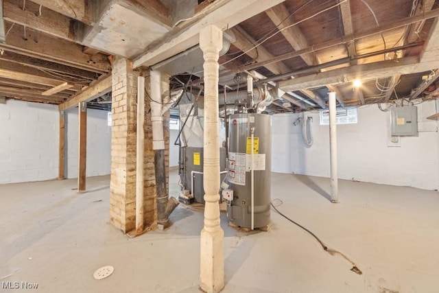 basement with electric panel, gas water heater, and heating unit