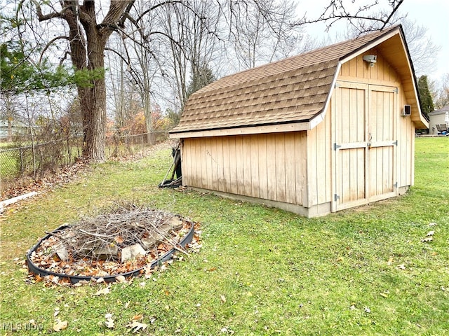 view of outbuilding featuring a yard