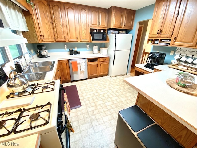 kitchen with white appliances and sink