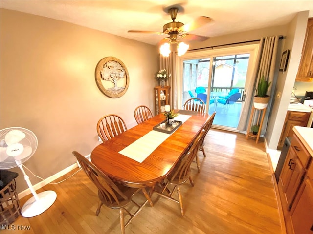 dining space with ceiling fan and light hardwood / wood-style floors