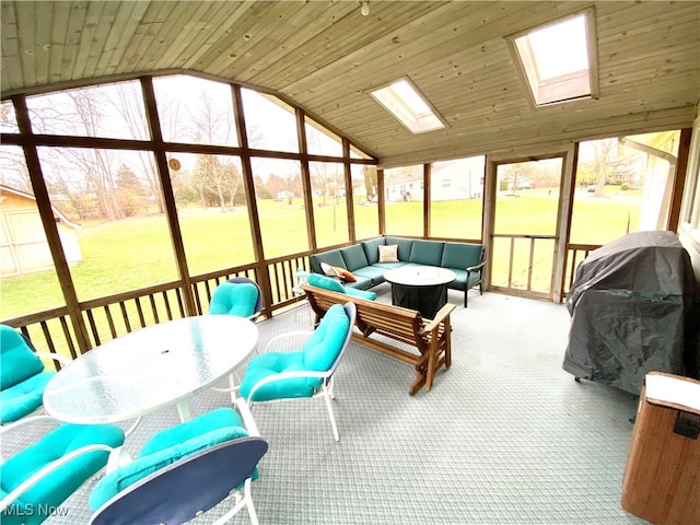 sunroom with lofted ceiling with skylight and wood ceiling